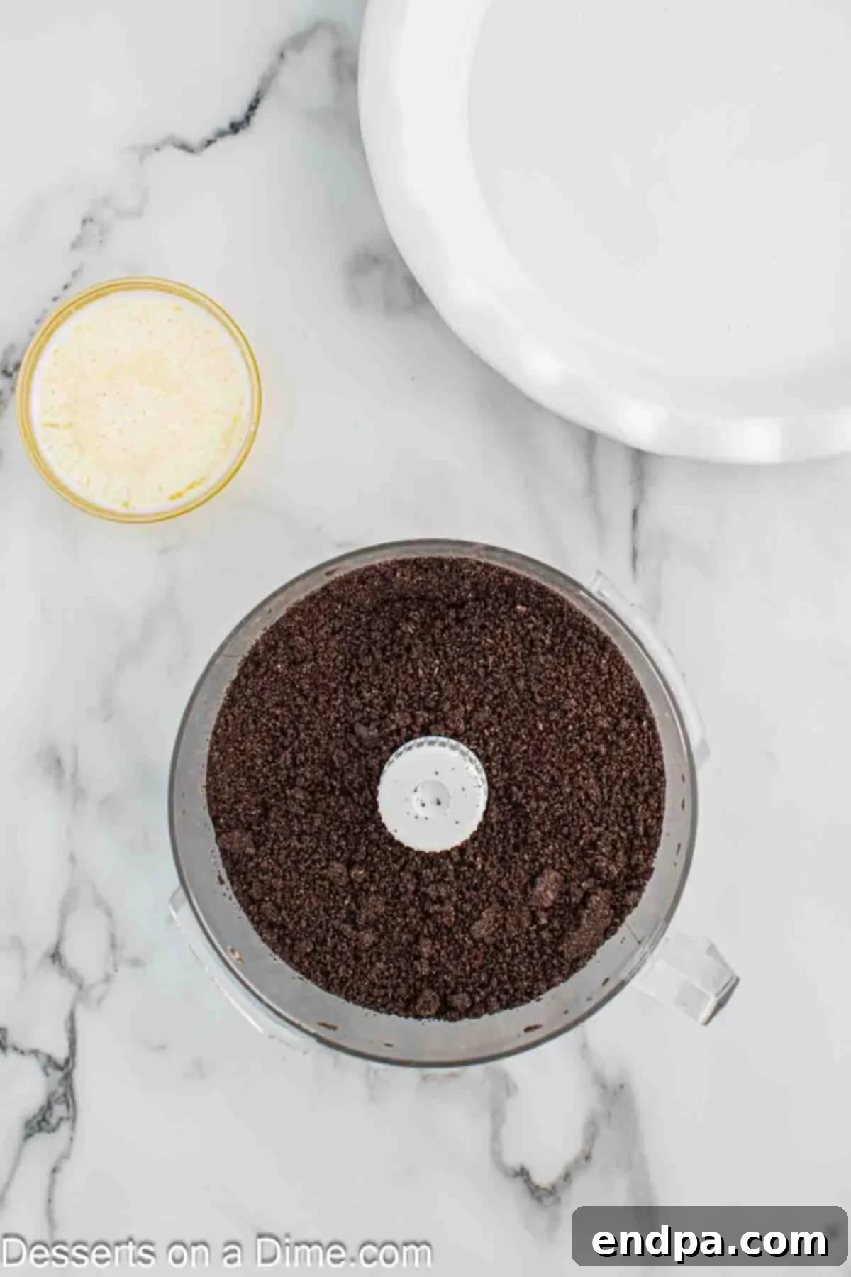 Crushing the Oreos in the food processor for the pie crust.