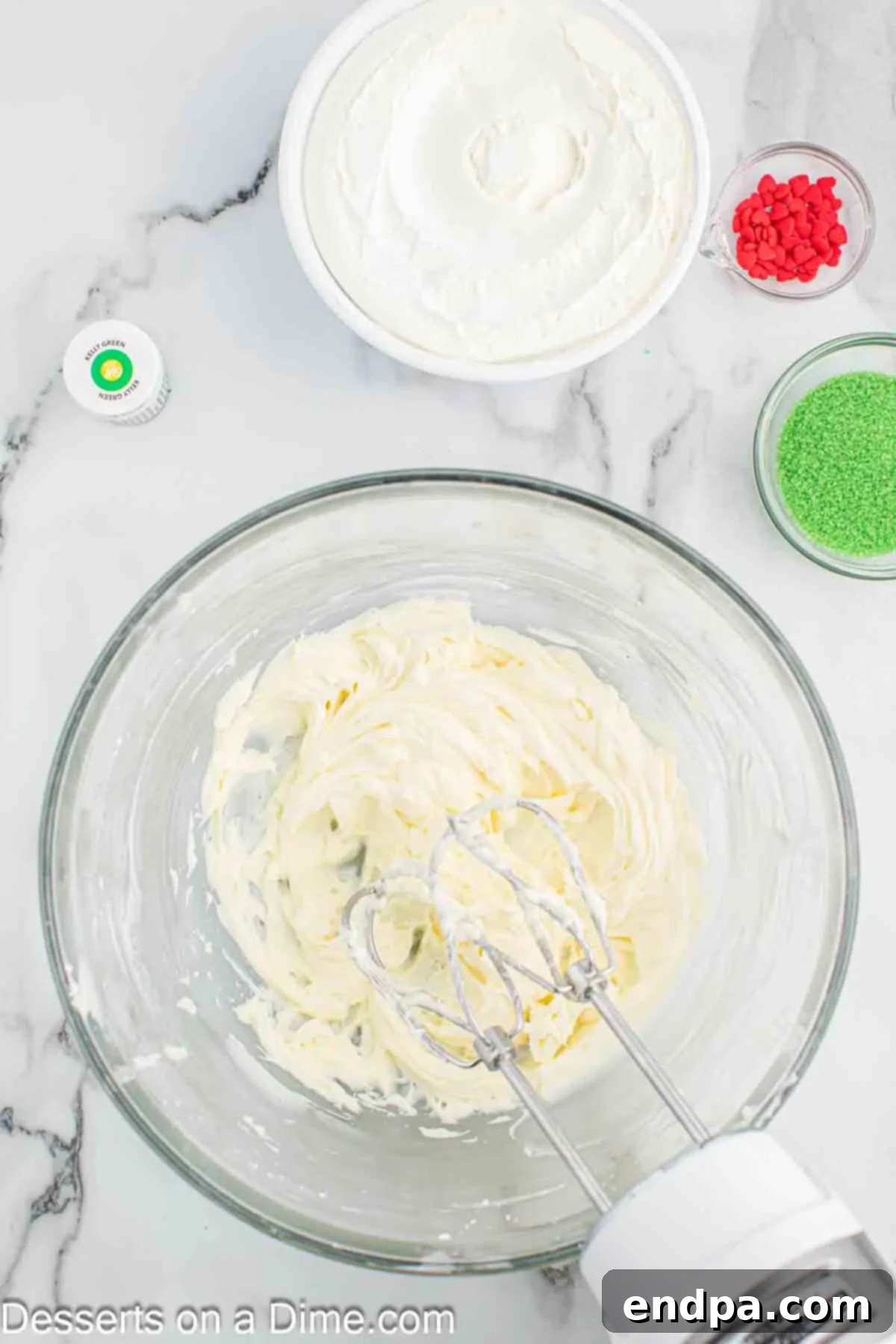 Beating cream cheese and powdered sugar together until smooth.