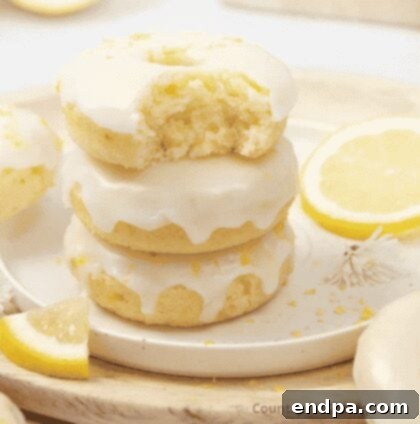 Soft and fluffy Lemon Donuts covered in a sweet lemon glaze.