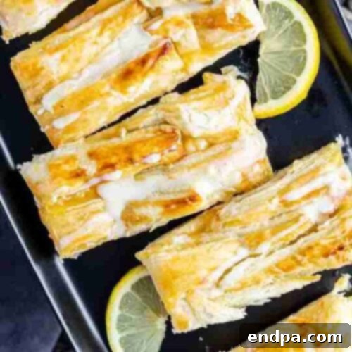 Flaky Lemon Cream Cheese Danish with a sweet and tangy filling, ideal for breakfast or dessert.