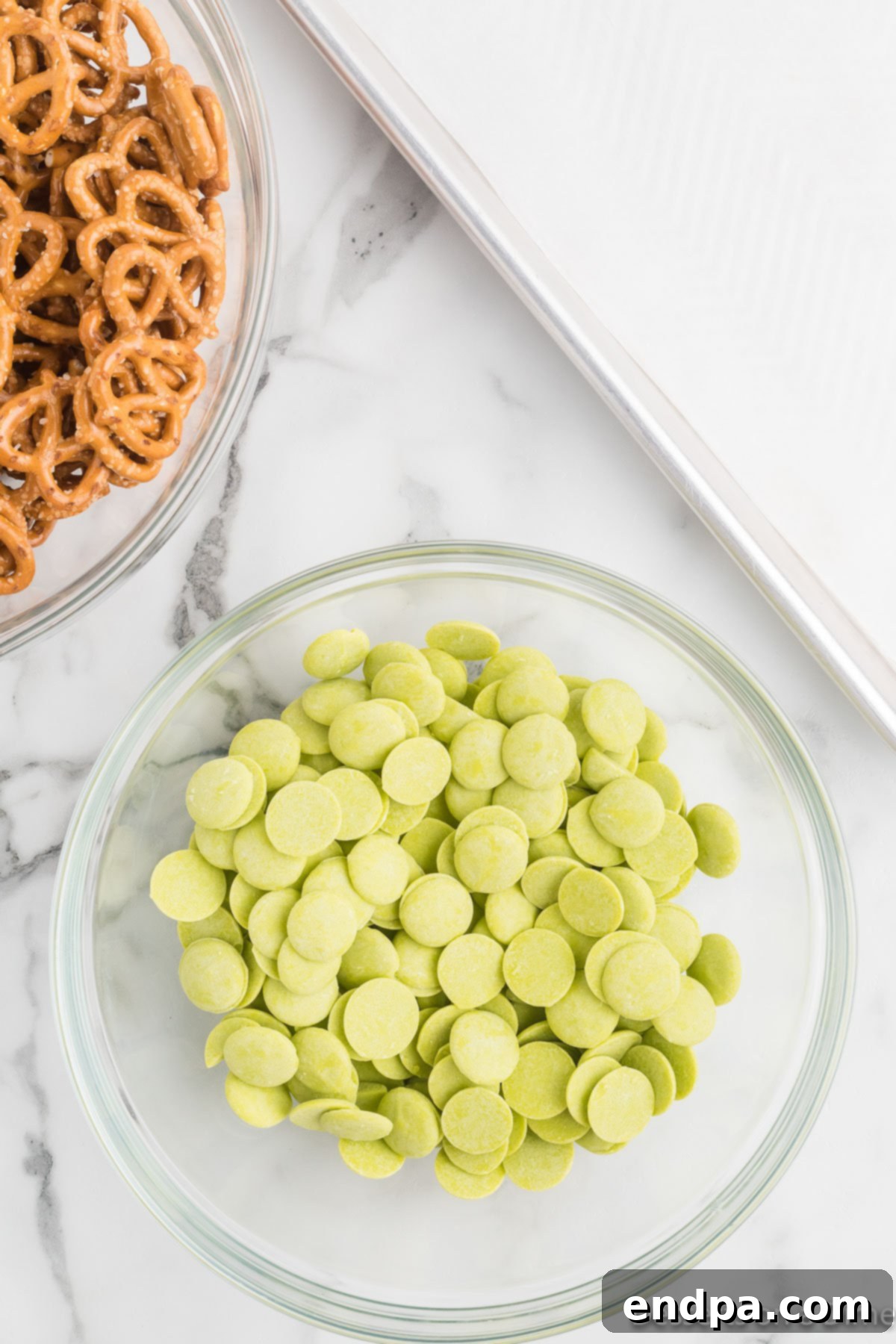 Green candy melts in a clear bowl