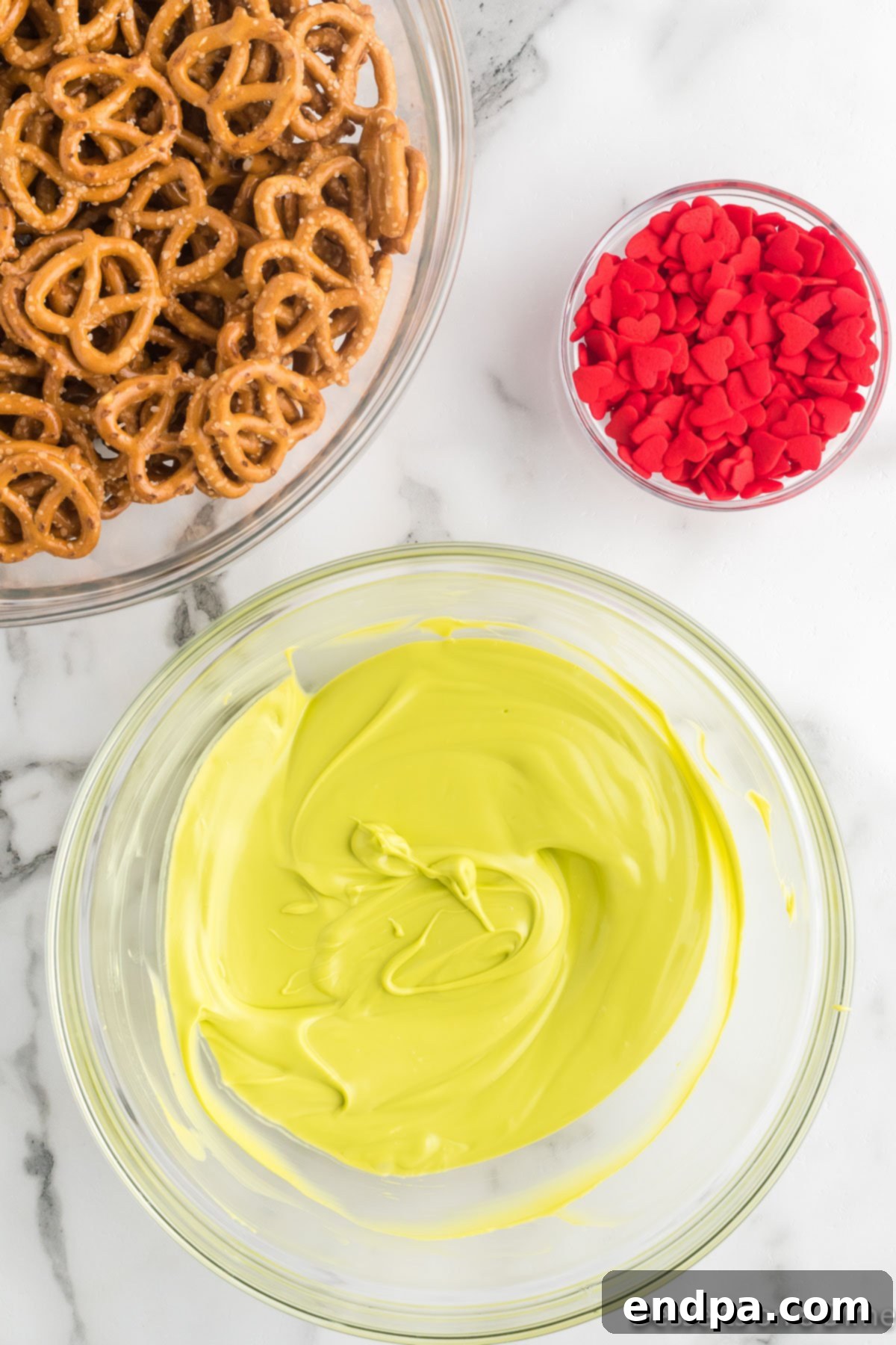 Melted green candy melts in a clear bowl