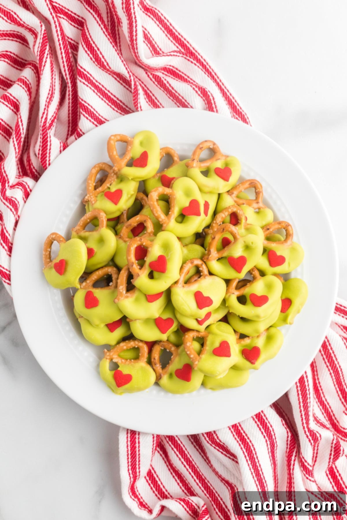 Grinch pretzels in a bowl. 
