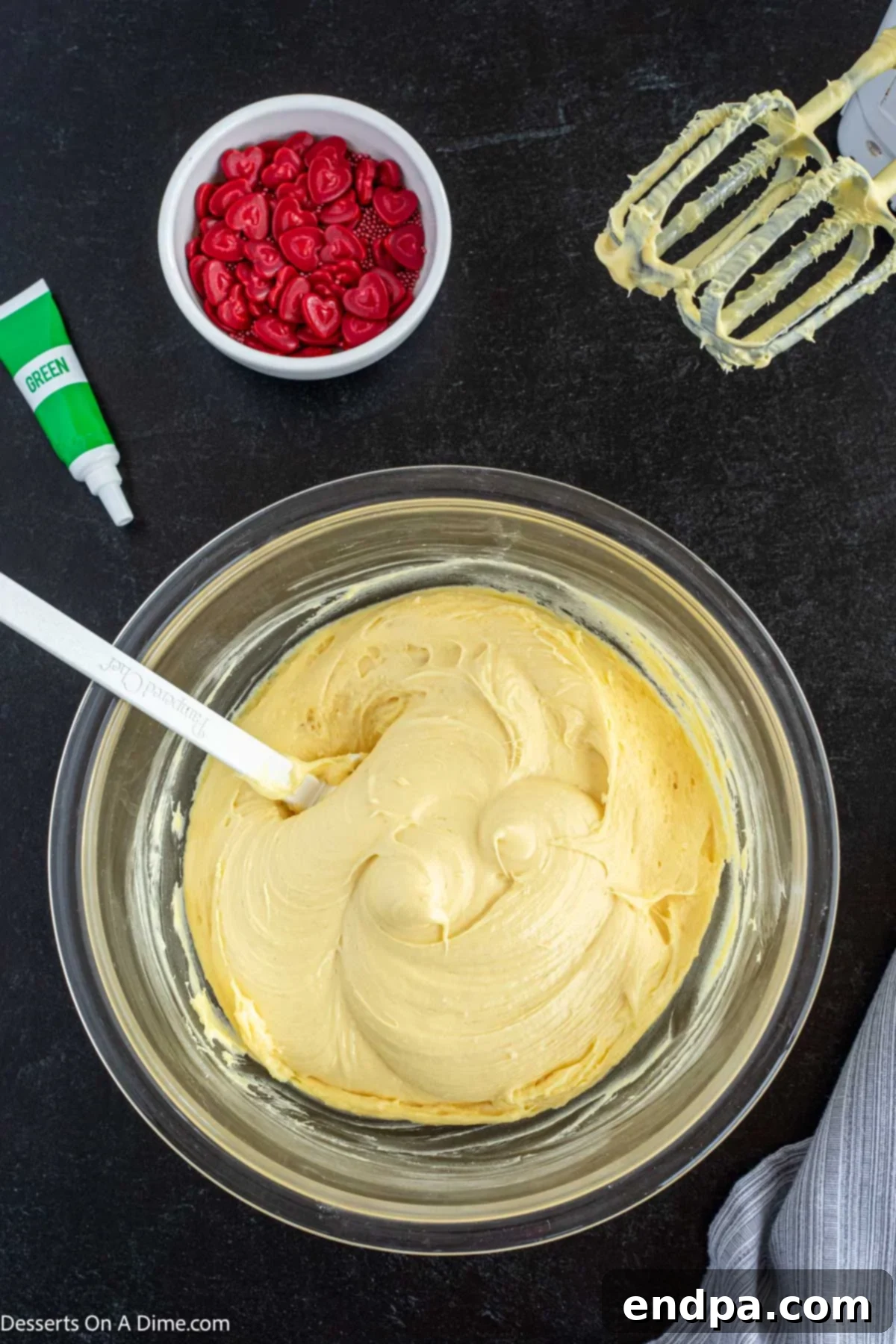 Heart-Growing Grinch Dip 4 Dry cake mix in a large microwave-safe bowl, after heat treatment.