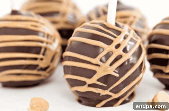 Crafting Irresistible Cake Pops 4 Rich Chocolate Peanut Butter Cake Pops, expertly coated for a decadent treat.