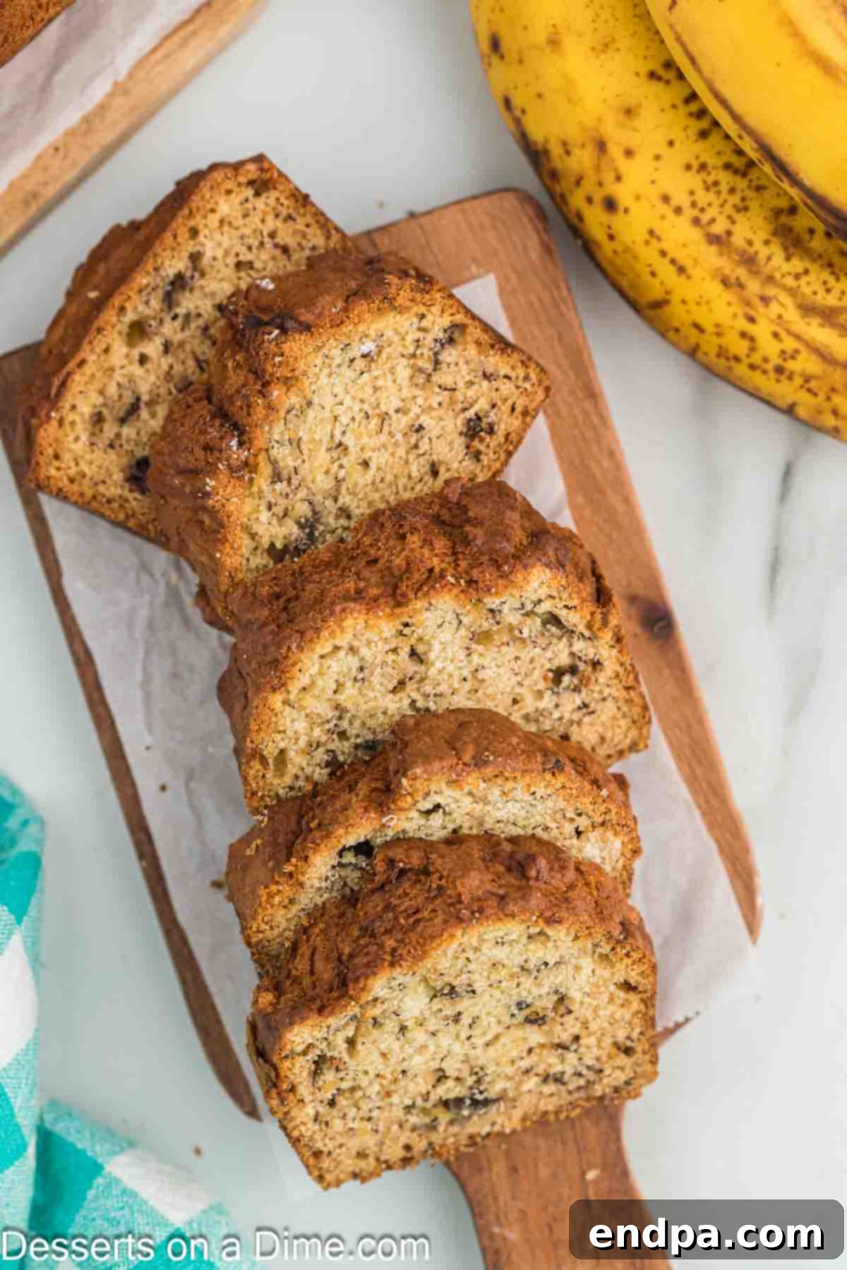 Golden Air Fryer Banana Loaf 8 Air Fryer Banana Bread sliced and stacked, ready to be enjoyed.