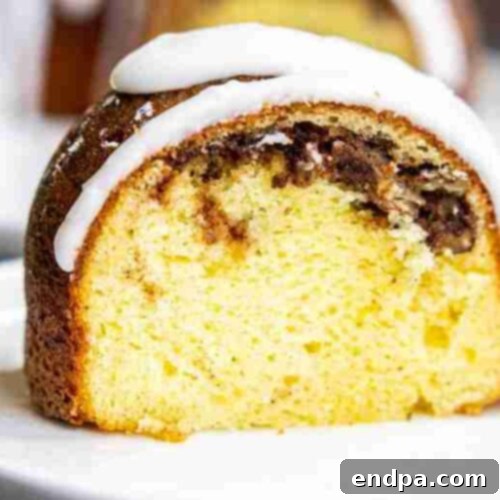 Sock It To Me Cake in a bundt pan with a glaze.