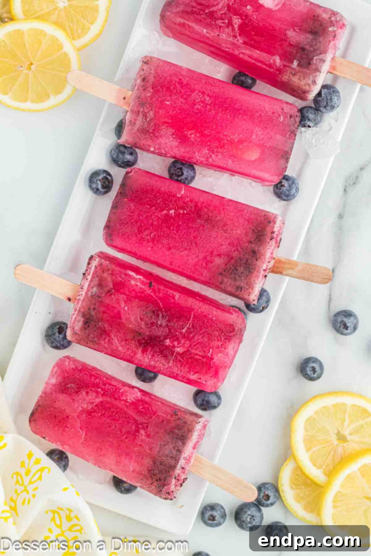 Blueberry lemonade popsicles ready to enjoy. 