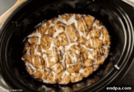 Crock Pot Cinnamon Roll Casserole in a slow cooker.