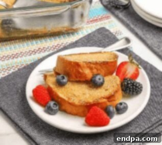 Overnight french toast on a plate with syrup.