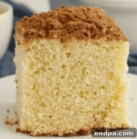 Coffee Cake slice on a white plate.