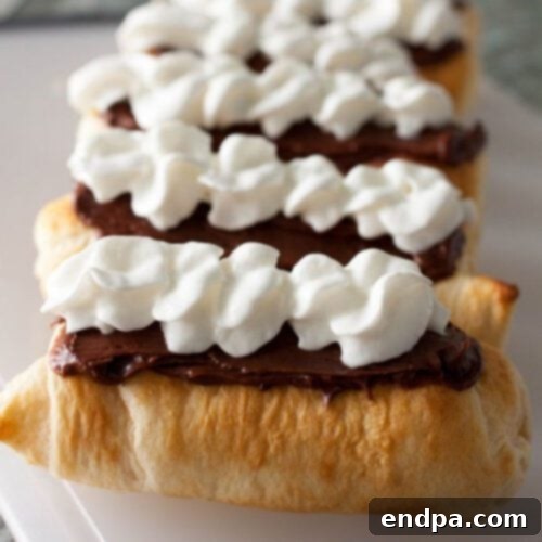 Campfire Eclairs, freshly cooked over a fire, ready for filling.