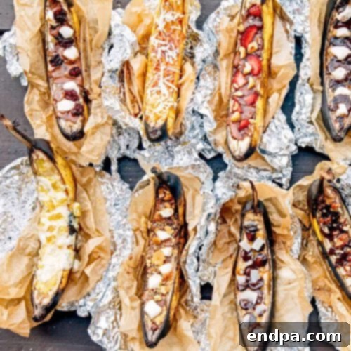 Gooey Campfire Banana Boats stuffed with chocolate and marshmallows, wrapped in foil, ready to be cooked over a fire.