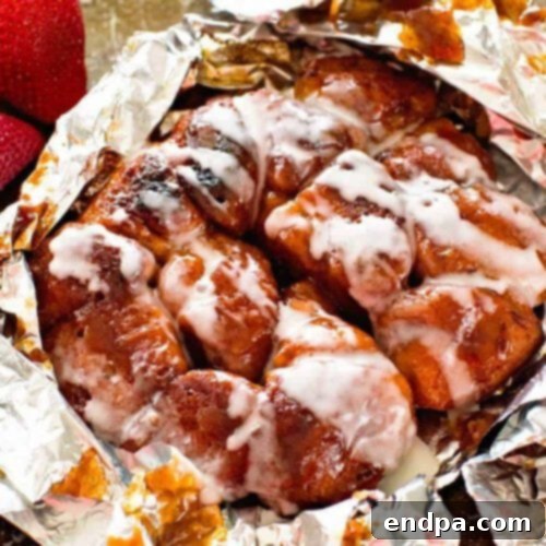 Warm Cinnamon Monkey Bread cooked in foil packets, with sweet glaze.