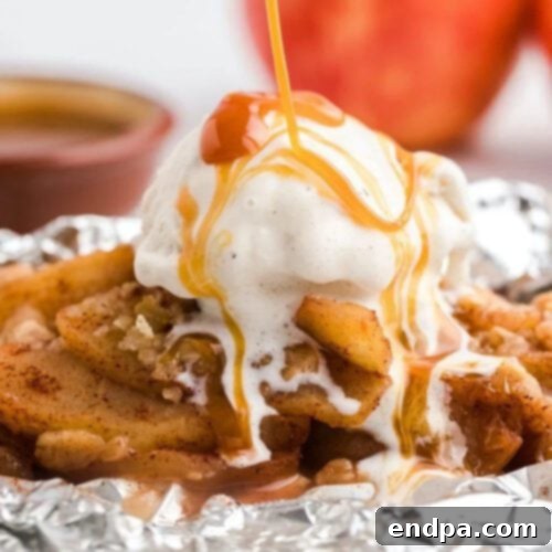 Individual Campfire Apple Crisp Foil Packets, showing the cooked apples and crispy topping.