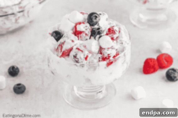 Red, White, and Blue Cheesecake Salad with fresh berries.