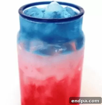 Red, White, and Blue layered drink in a glass.