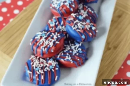 4th of July Chocolate Covered Oreos with patriotic sprinkles.