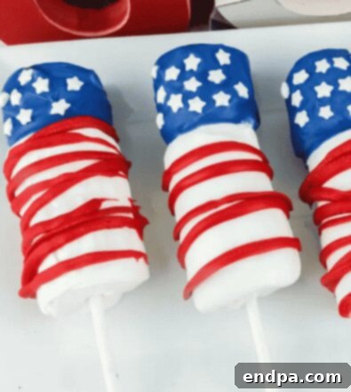 American Flag Marshmallow Pops decorated with patriotic colors.