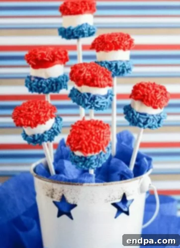 Marshmallow Pops decorated with red, white, and blue sprinkles.