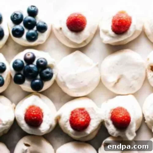 Red, White, and Blue Mini Pavlovas with berries and cream.