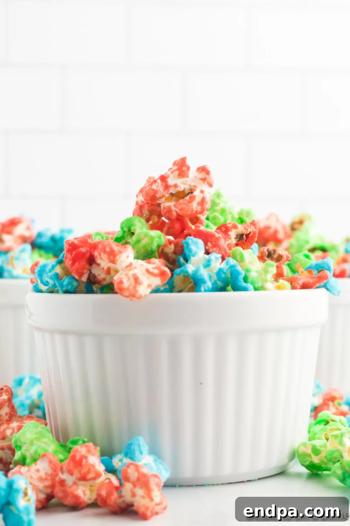 A close-up shot of vibrant Candy Popcorn in a bowl, showing its varied colors and appealing texture.