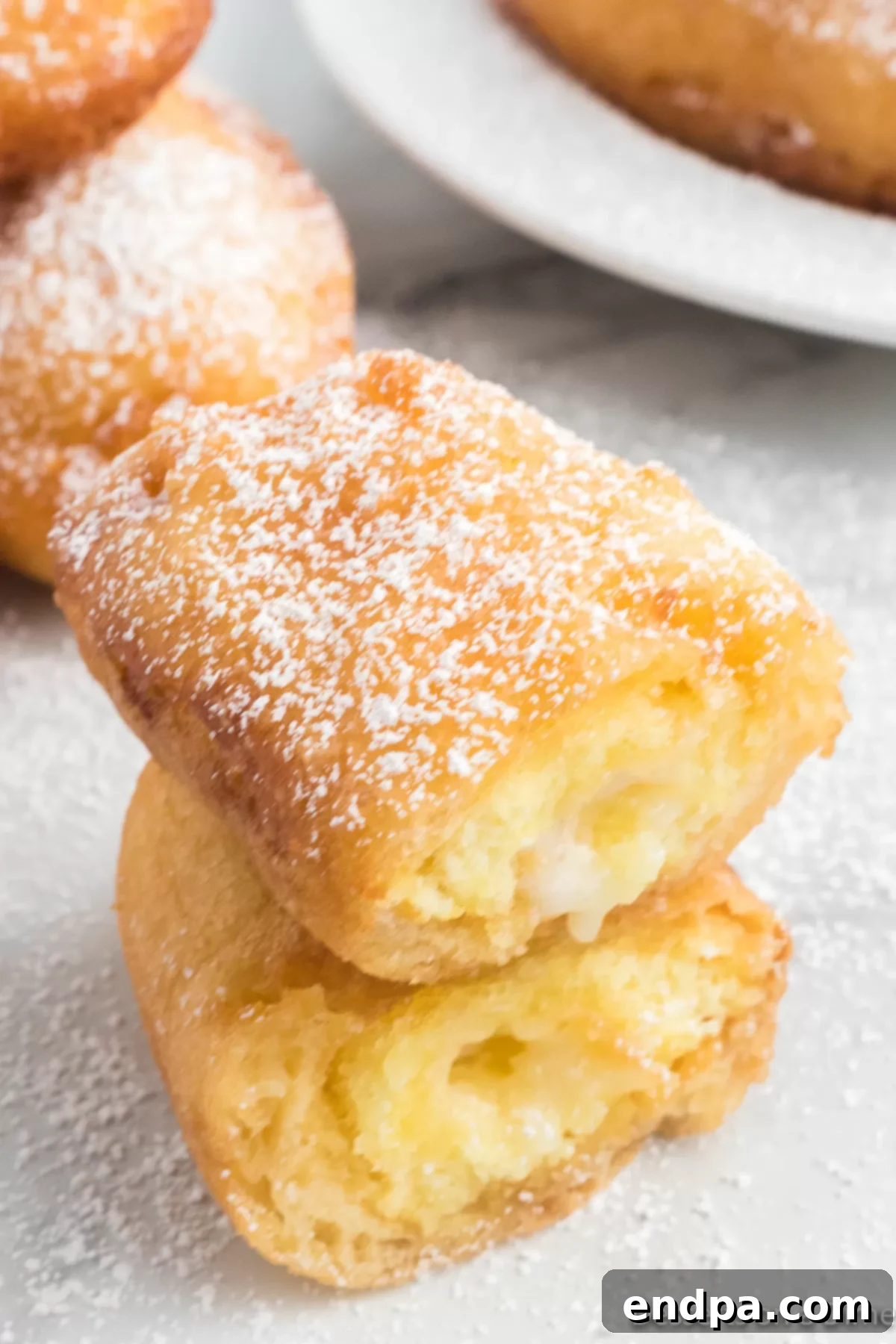 Golden Gooey Goodness 7 Twinkie fried and topped with powdered sugar.
