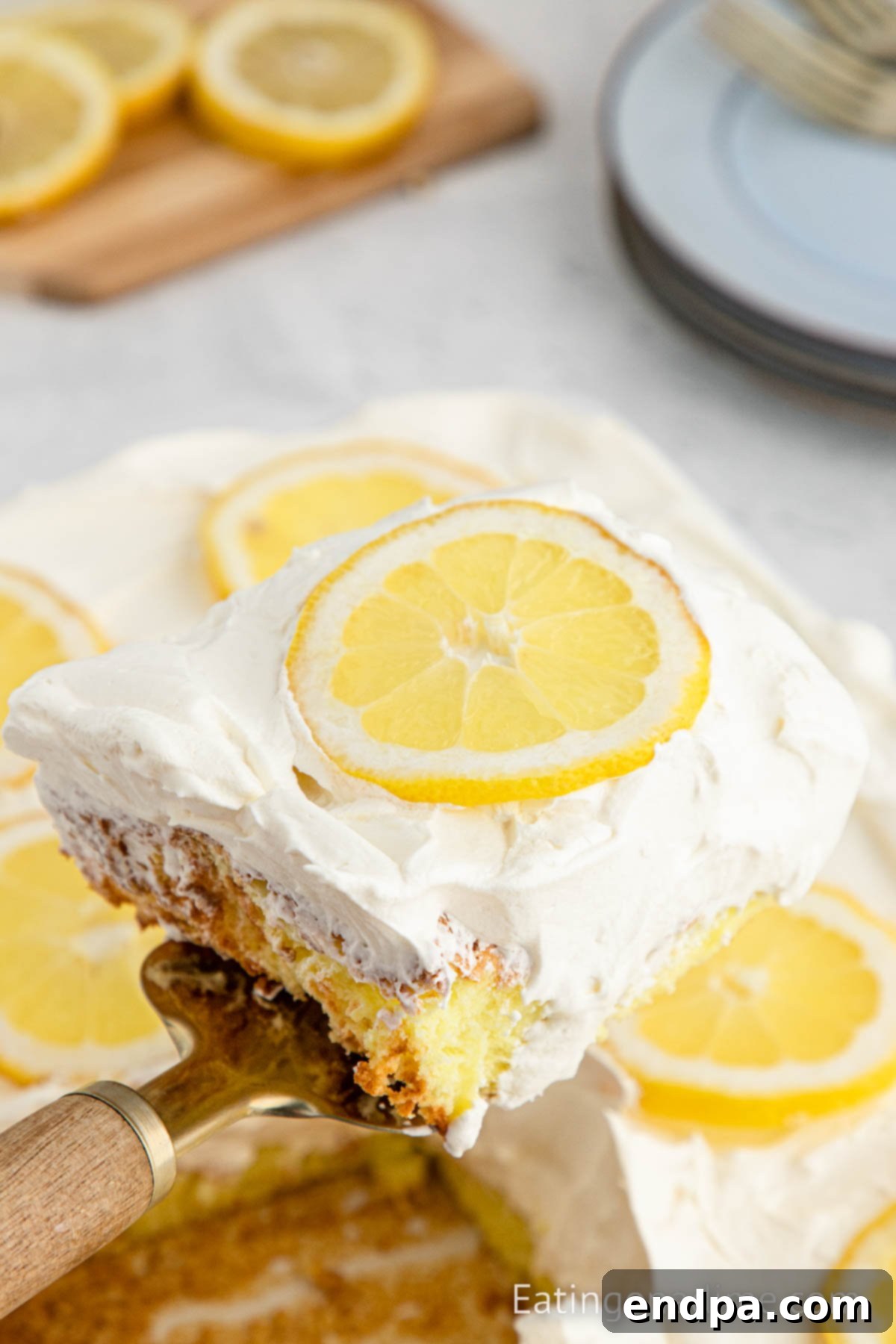 Sunshine Lemon Angel Delight 8 Lemon Angel Food Cake cut and being served.