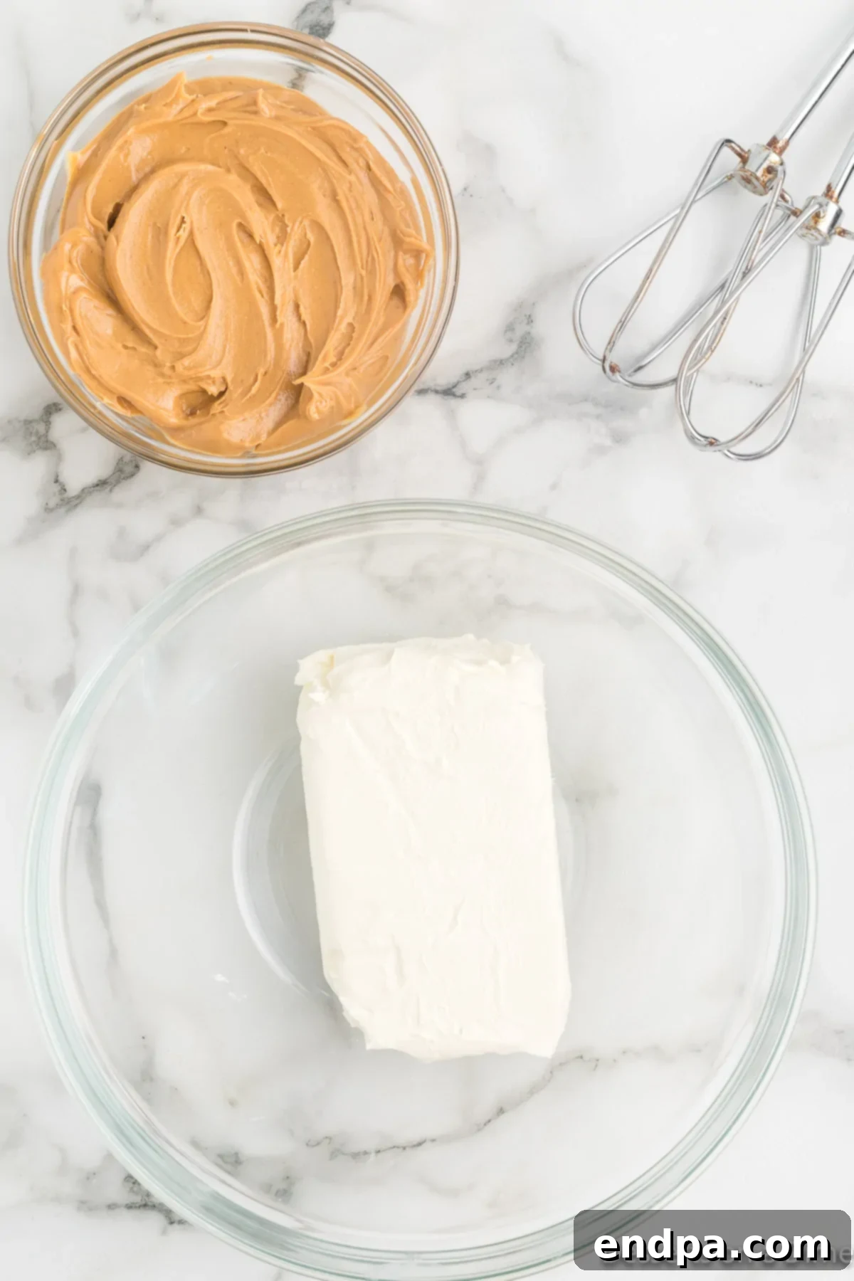 Dreamy Peanut Butter Chocolate Dip 4 Softened cream cheese being added to a mixing bowl, ready to be combined with other ingredients for Buckeye Dip.