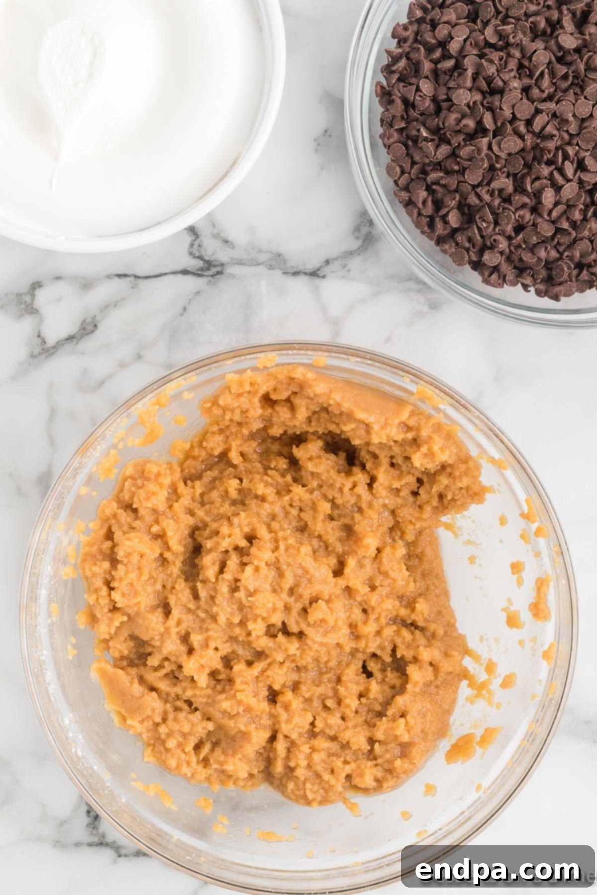 Dreamy Peanut Butter Chocolate Dip 5 The smooth mixture of cream cheese and peanut butter in a bowl after being thoroughly combined, showing its creamy texture.