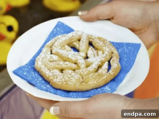 Baked Funnel Cakes, a healthier alternative to deep-fried versions, perfect with fruit.