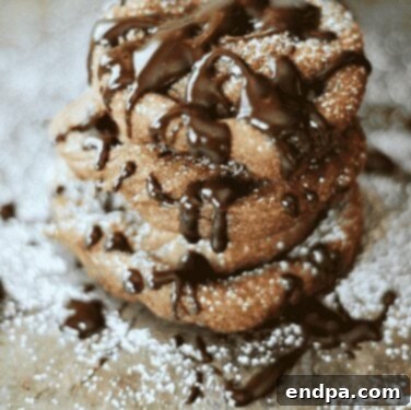 Mini Banana Funnel Cakes infused with cinnamon, drizzled with chocolate ganache.