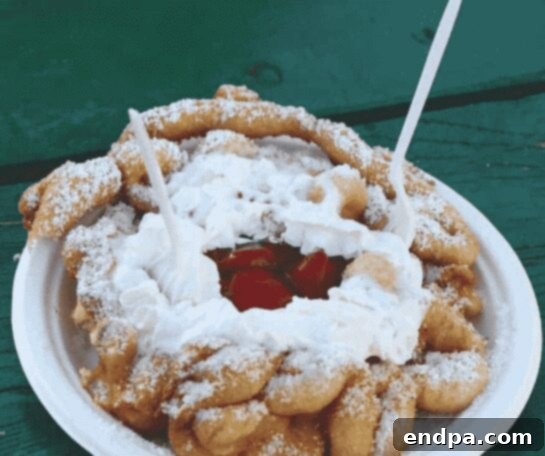 Light and fluffy Air Fryer Funnel Cakes, a perfect summer dessert.