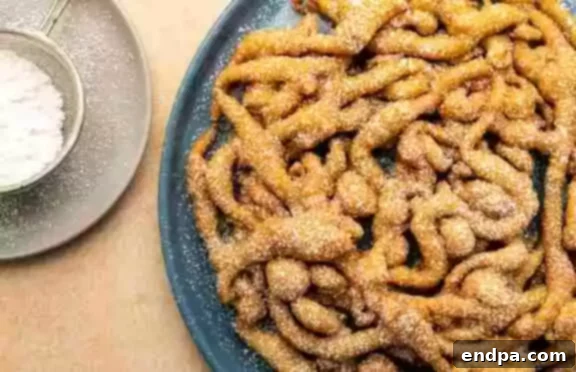 Easy Pancake Mix Funnel Cakes, quick to make and great with cinnamon sugar.