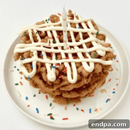 Funfetti Funnel Cakes, a colorful celebration with frosting and sprinkles.