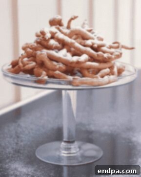 Crunchy Buttermilk Funnel Cakes, just like fried dough at county fairs.