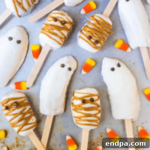 Banana popsicles decorated for Halloween.