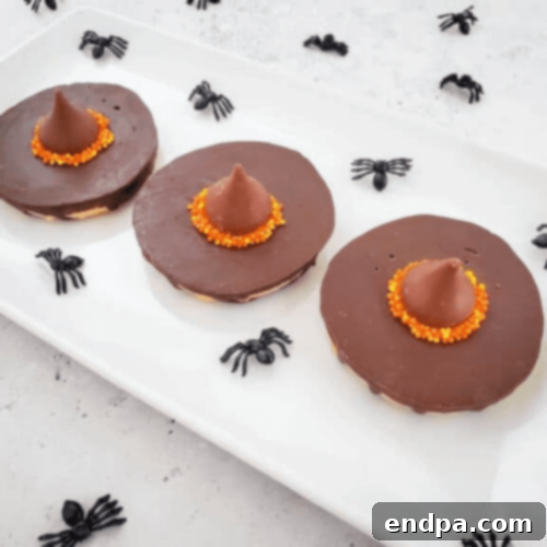 Harry Potter witch hat cookies on a platter.