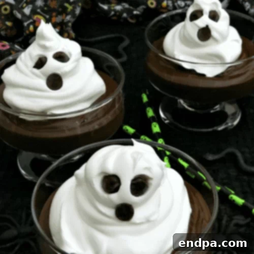 Whipped cream ghosts on cups.