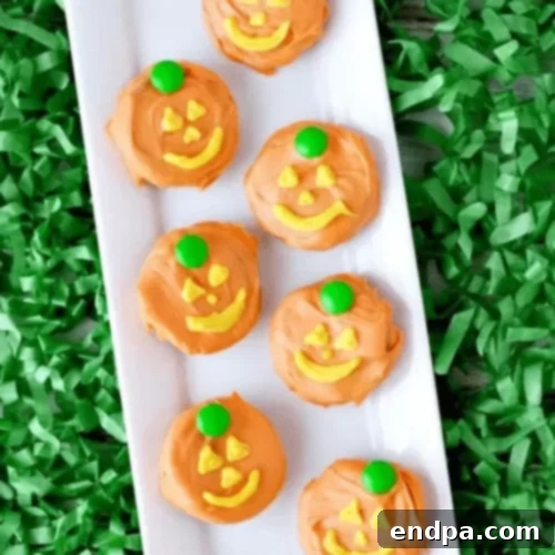 Jack o Lantern covered oreos on a platter.