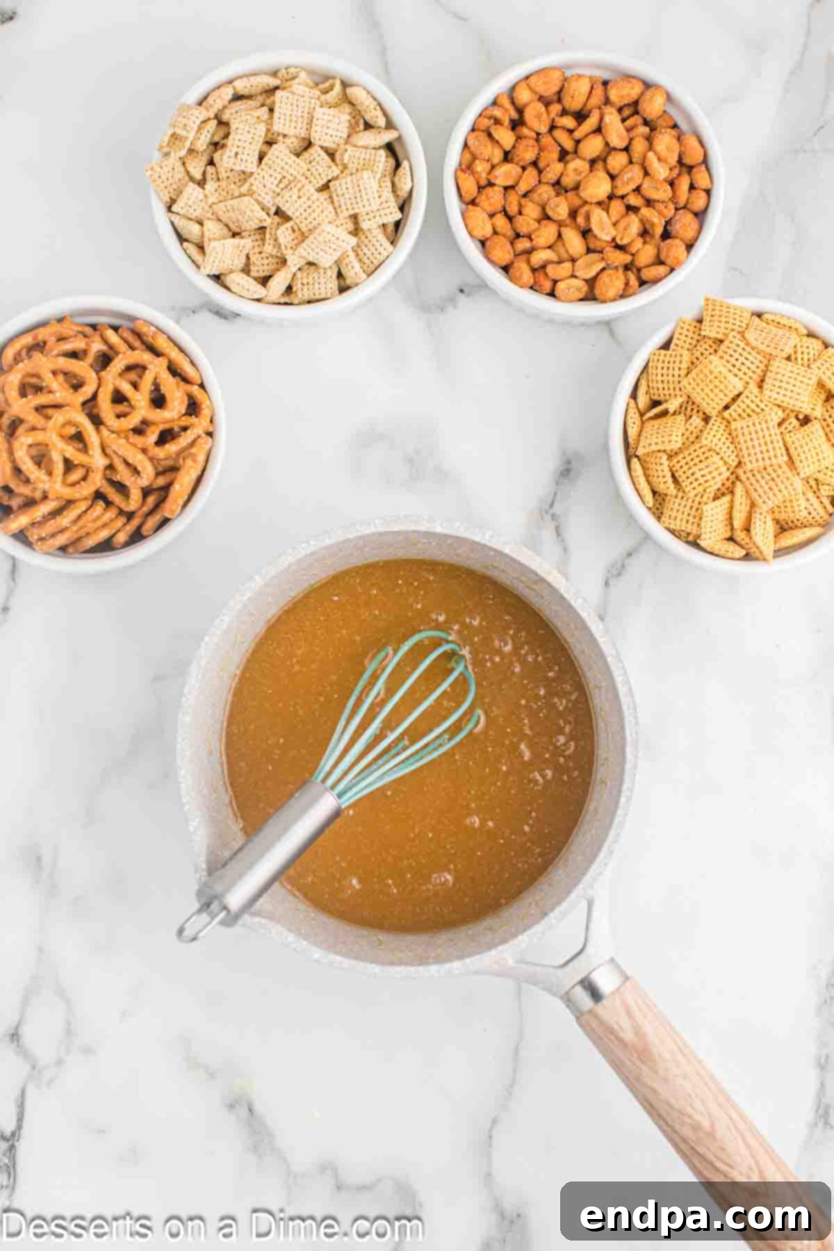 Mixture removed from heat and corn syrup and baking soda added.