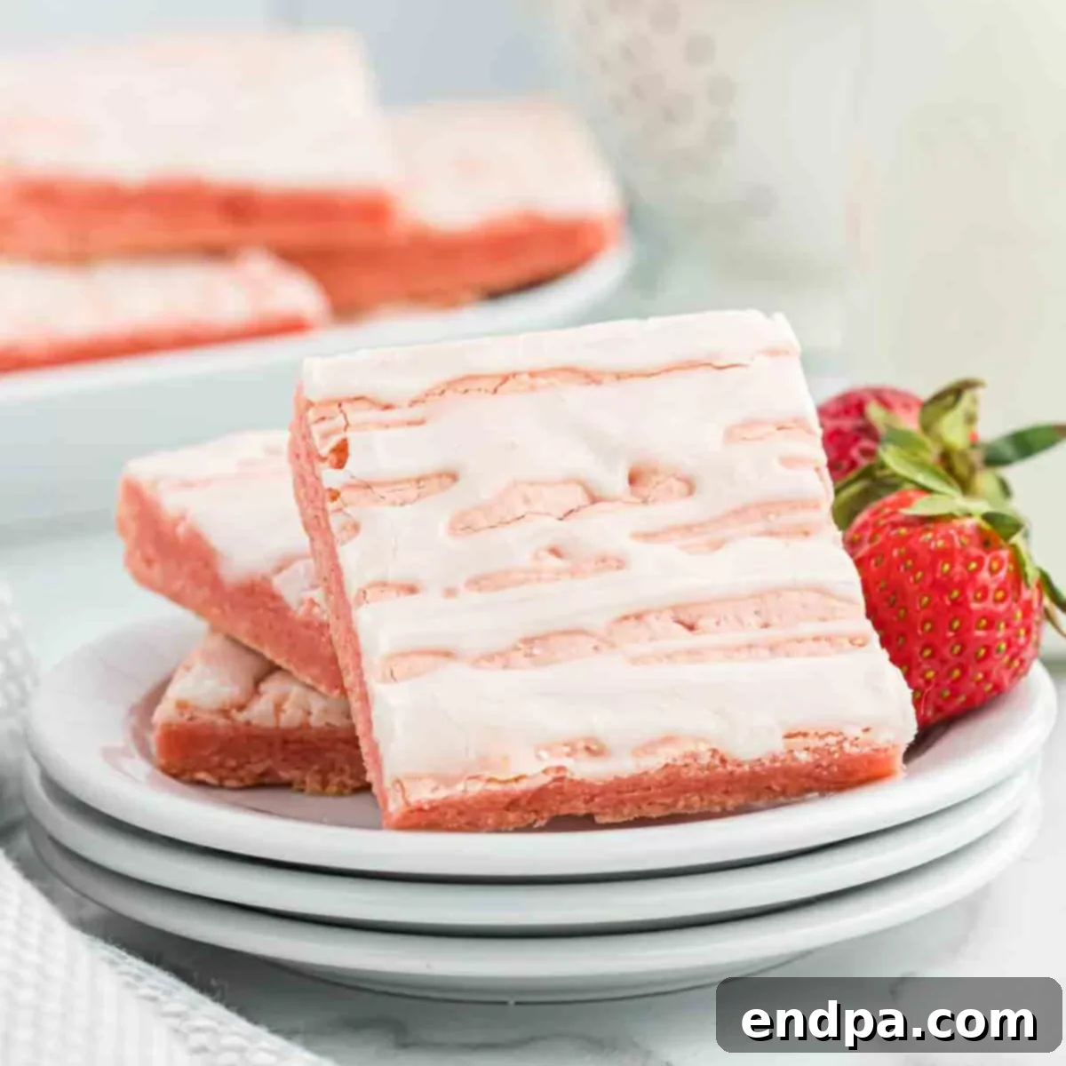 A large image of the finished Strawberry Brownies, cut into squares and glazed.