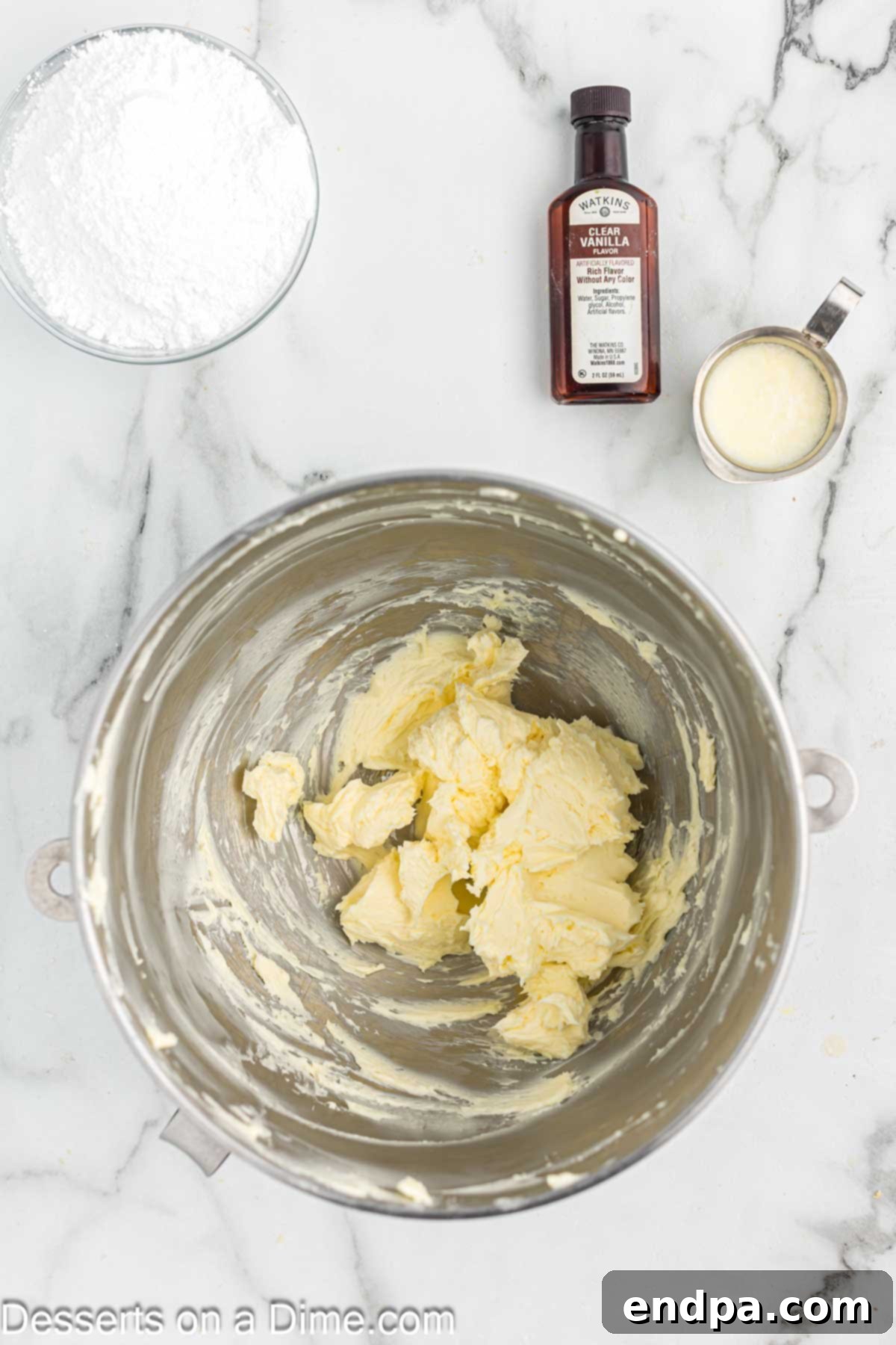 Softened butter in a mixing bowl, ready to be beaten for the creamy orange creamsicle frosting.