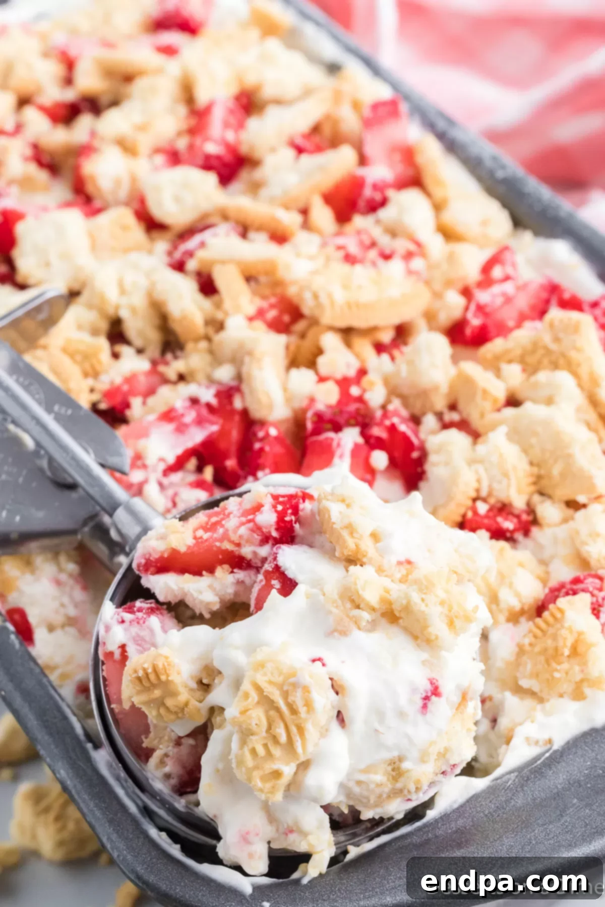 Scoops of creamy homemade Strawberry Shortcake Ice Cream in a bowl.
