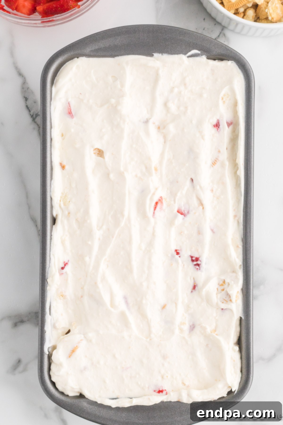 Ice cream mixture spread into loaf pan.