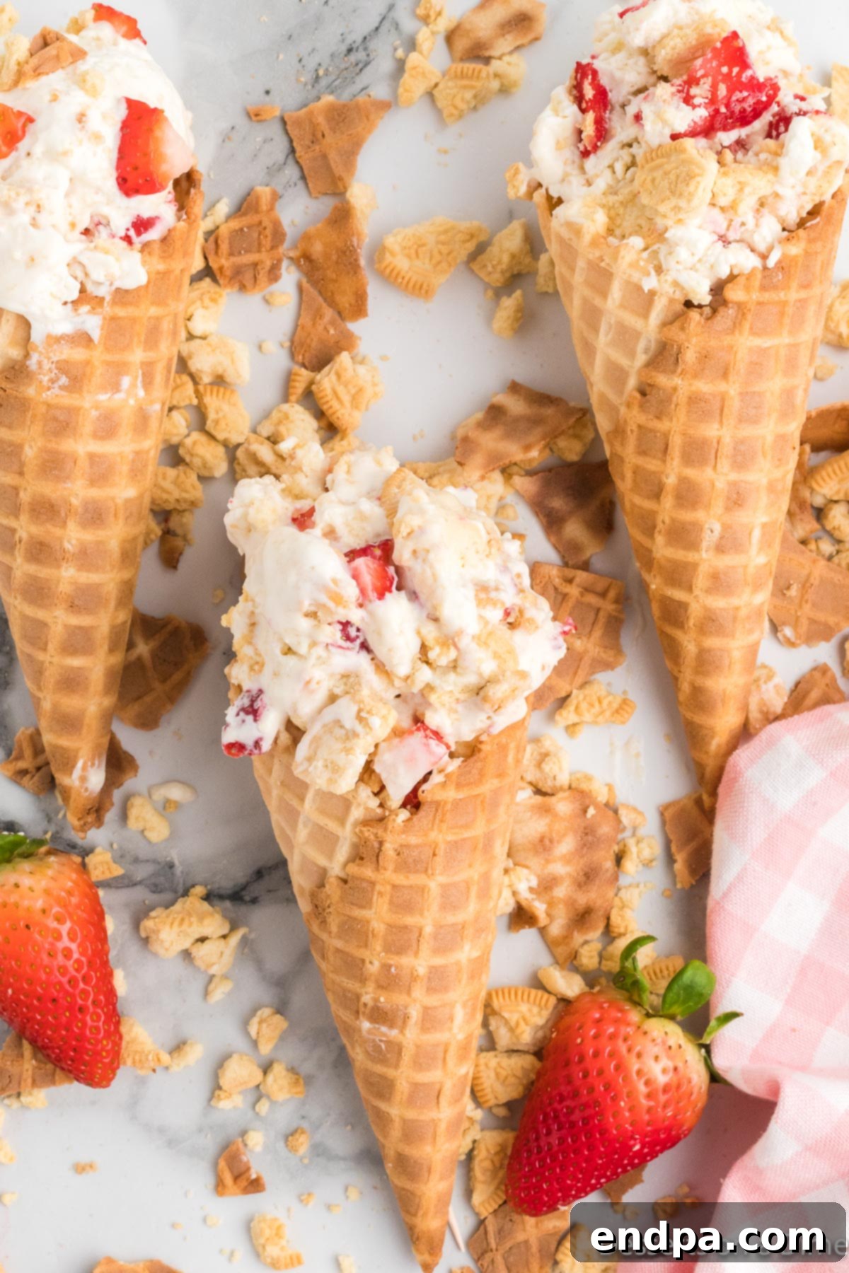 Ice cream cones filled with strawberry shortcake ice cream
