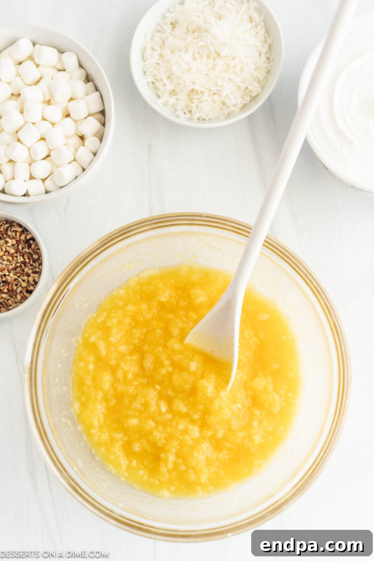 Tropical Pineapple Dream 4 A mixing bowl with instant vanilla pudding mix and crushed pineapple combined and ready for the next step.