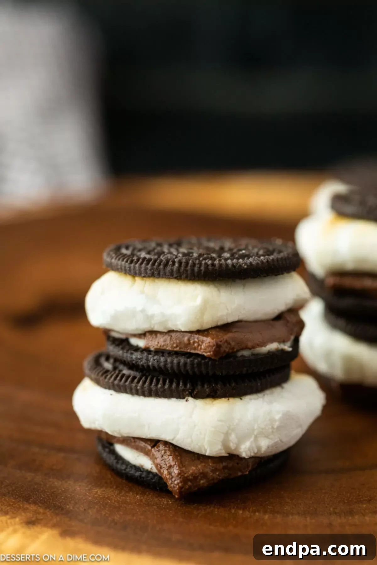 Oreo S'mores Dream 8 Several stacked Oreo S'mores showing the layers of marshmallow, chocolate, and Oreo cookies.