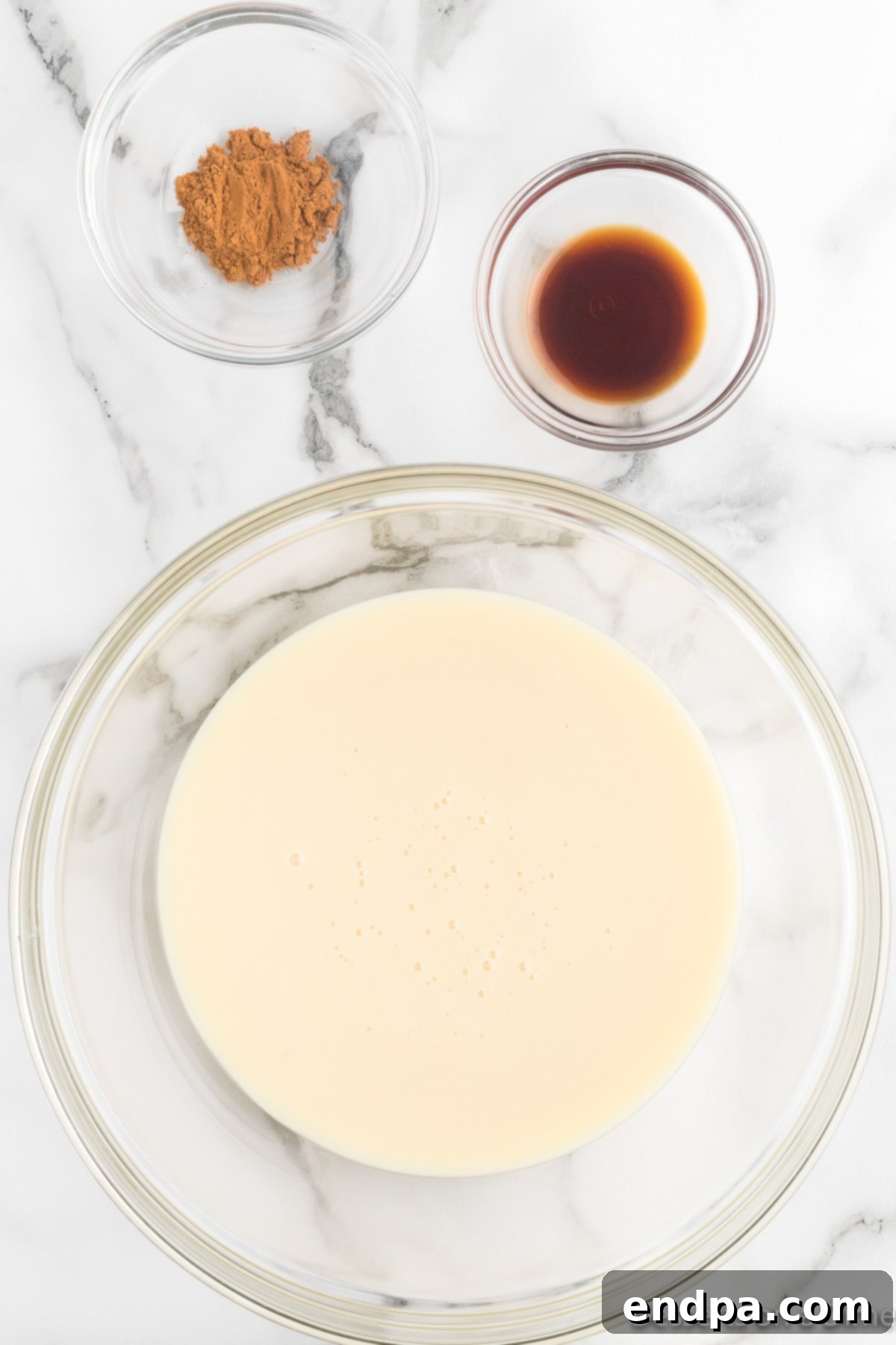 Merry Melts 5 Sweetened condensed milk in a separate mixing bowl, ready for other ingredients.