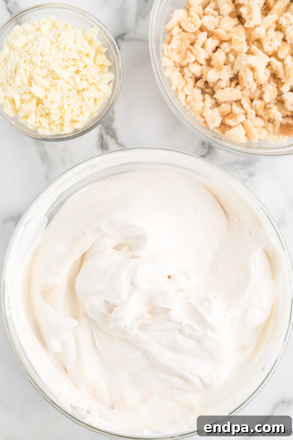 Merry Melts 7 Gently folding whipped cream into the sweetened condensed milk mixture.